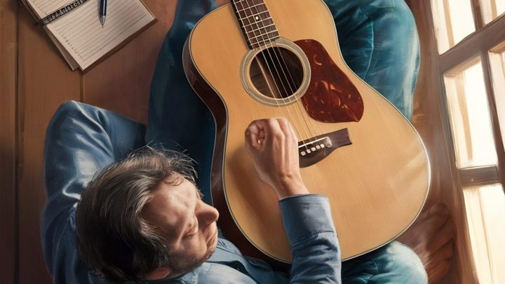 Une personne s’exerce à la guitare dans une pièce, avec une horloge visible en arrière-plan.